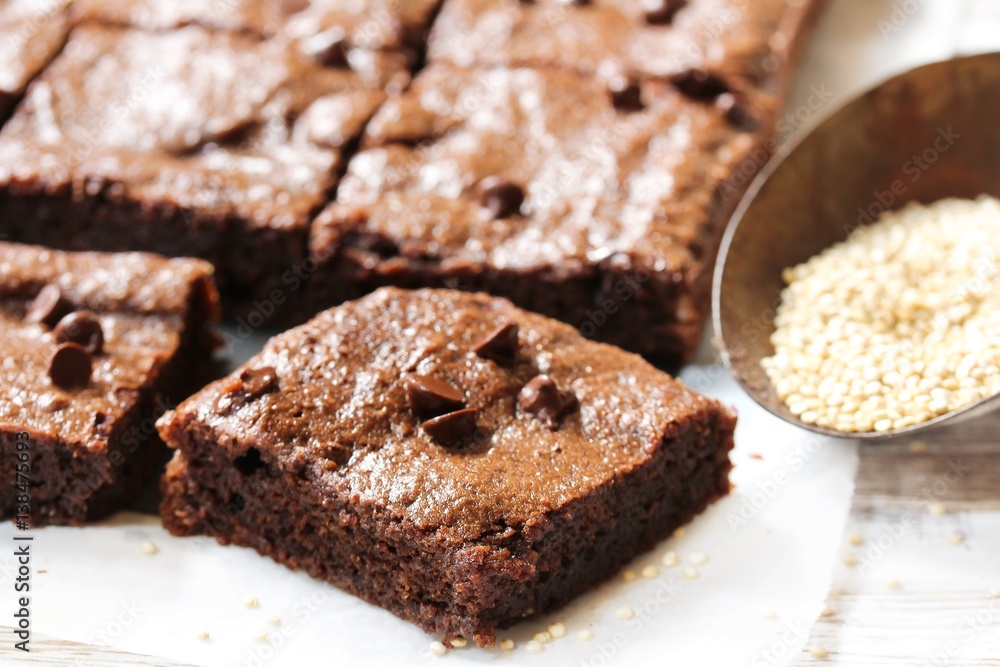 Homemade Quinoa Brownies on white wooden background, selective focus