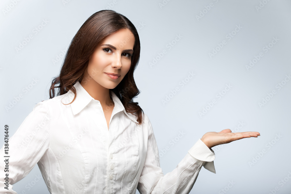 businesswoman, showing something or blank copyspace businesswoman, showing something or blank copyspace
