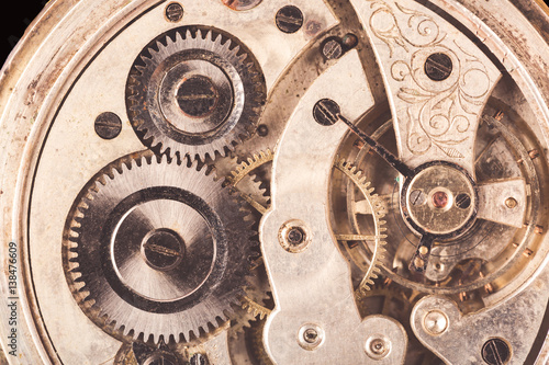Close-up of old clock rusty mechanism with gears. Vintage toned