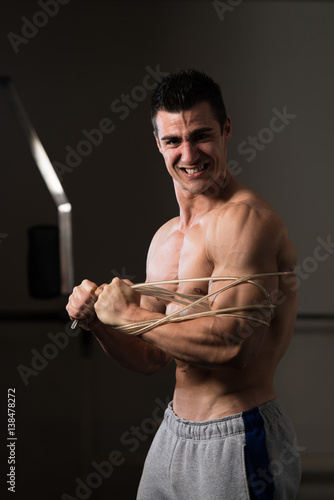 Handsome Man Wrapt Up With Cable photo