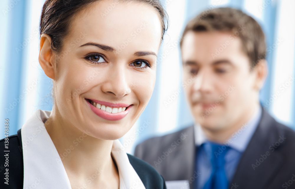businesspeople, or businesswoman and client businesspeople, or businesswoman and client