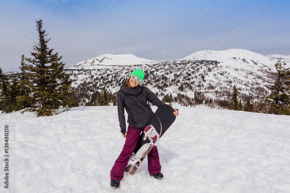 Portrait of young smiling woman with snowboard Portrait of young smiling woman with snowboard
