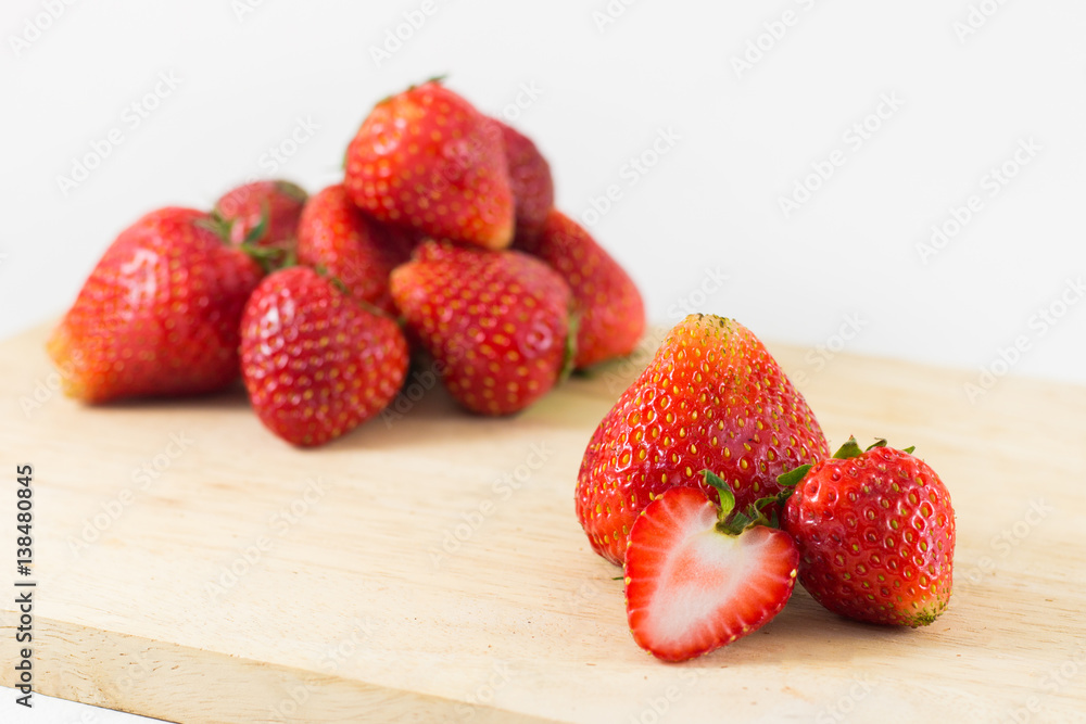 Strawberrys on wood isolated on white background.