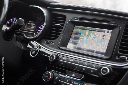 gps with the route on the dashboard of a car photo