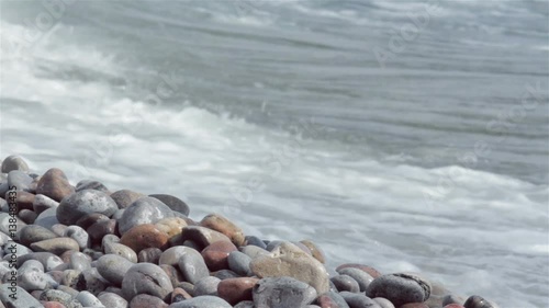 waves crash along a rocky shore