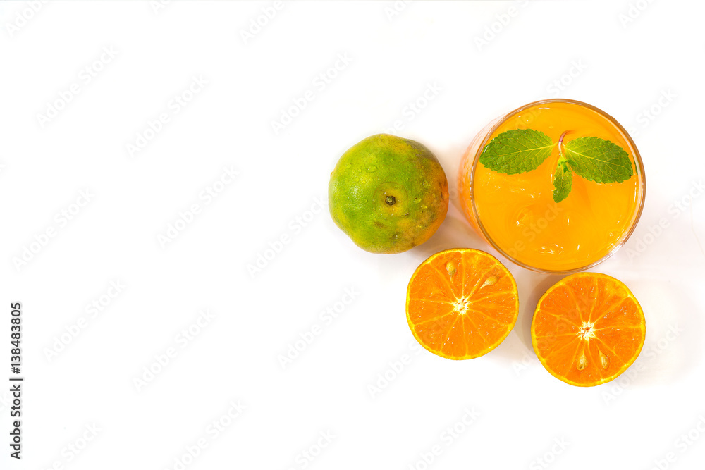 Fresh orange and juice in glass on white background / Selective focus and top view image with space for text Fresh orange and juice in glass on white background / Selective focus and top view image with space for text