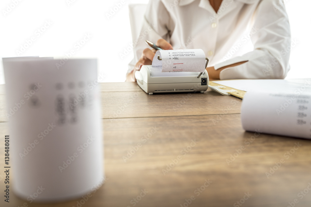 Financial adviser making calculations Financial adviser making calculations