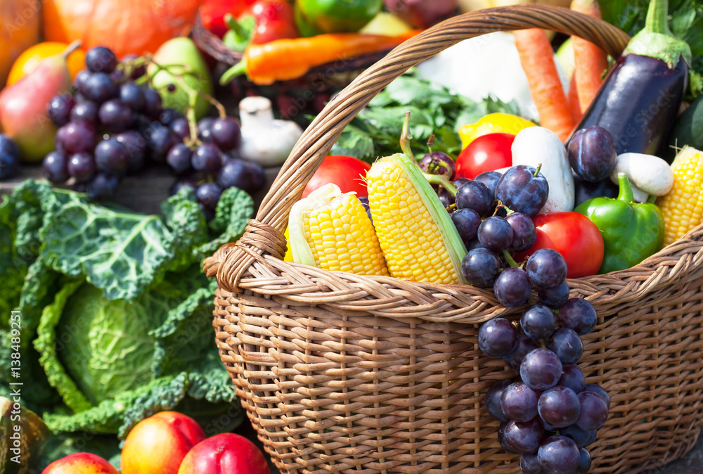 Fruits and vegetables like tomatoes, eggplants, corns and grapes arranged in a group. Natural still life for healthy food. Fruits and vegetables like tomatoes, eggplants, corns and grapes arranged in a group. Natural still life for healthy food.