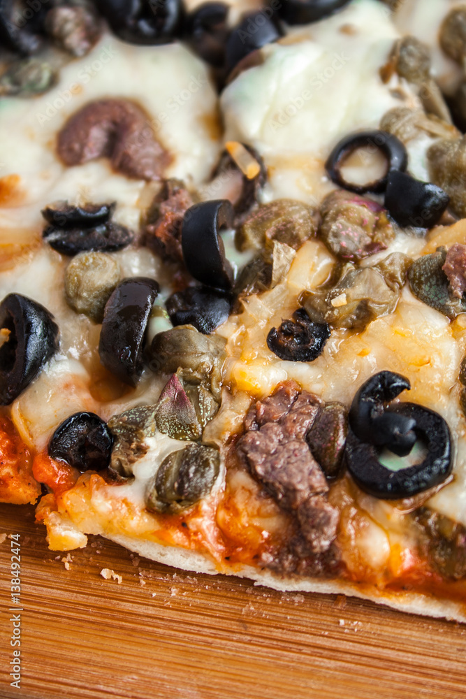 Organic Homemade pizza with mushrooms in a wood table. Organic Homemade pizza with mushrooms in a wood table.