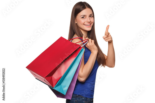 Smile beautiful happy woman holding shopping bags, isolated on white background