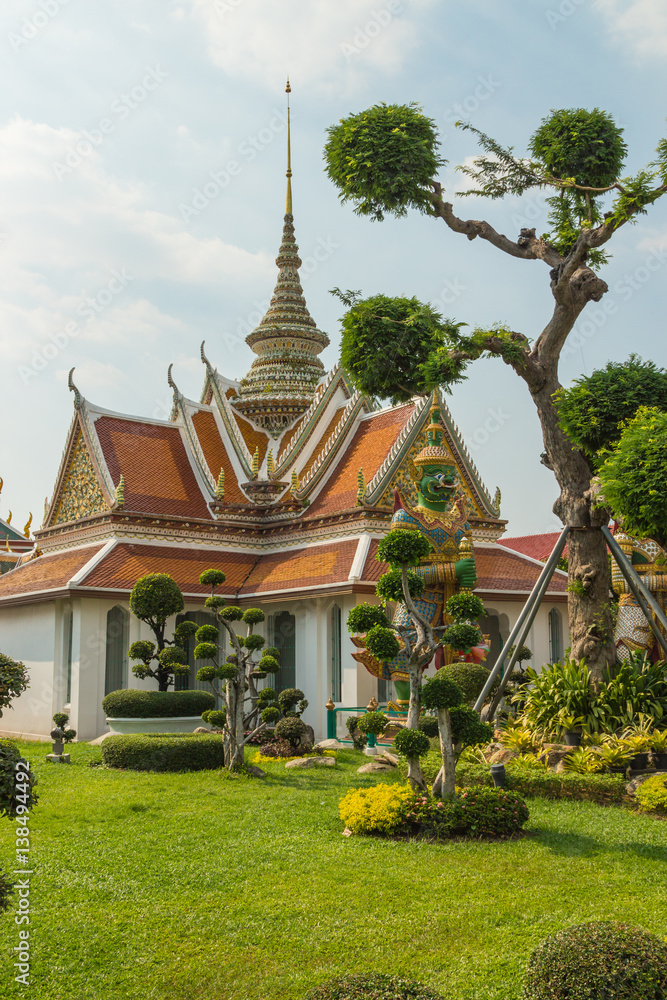 Decorative gardens and front gate to Wat Arun Temple in Bankgkok, Thailand