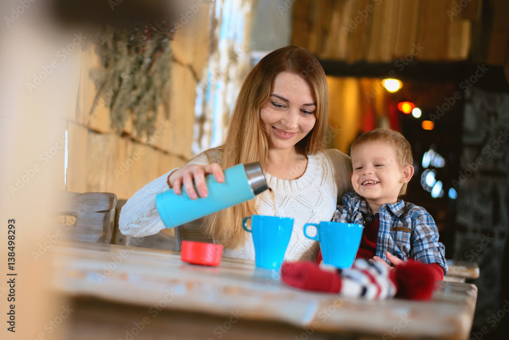Fototapeta premium Winter holidays mom with a child