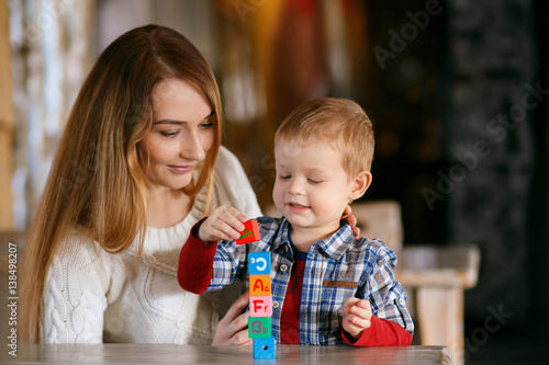 Mom collects cubes with child