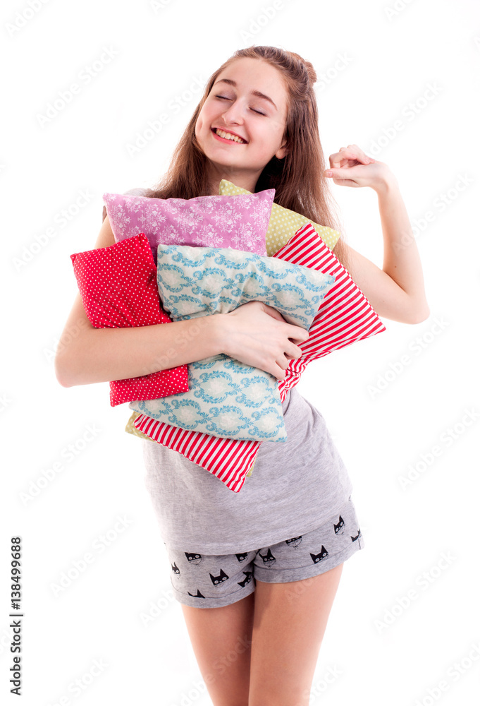 Pretty girl hold colour pillows isolated Pretty girl hold colour pillows isolated