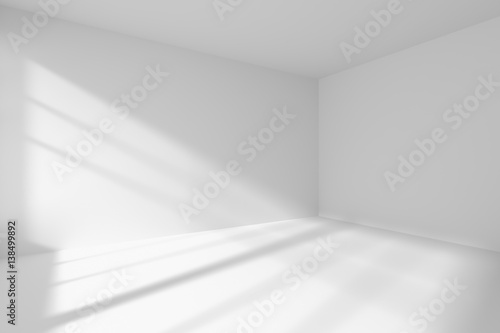 Empty white room corner with sunlight