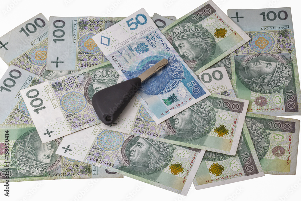 Car keys on Polish zloty notes background isolated Car keys on Polish zloty notes background isolated