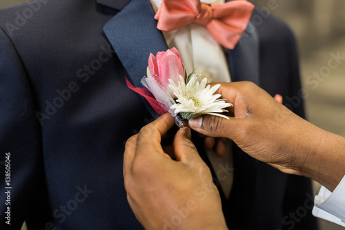 Pinning boutonniere to lapel