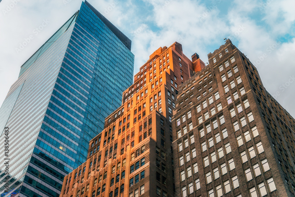 Fototapeta premium NEW YORK CITY, USA: Buildings and street life on the Broadway.It is the oldest north–south main thoroughfare in New York City, dating to the first New Amsterdam settlement.
