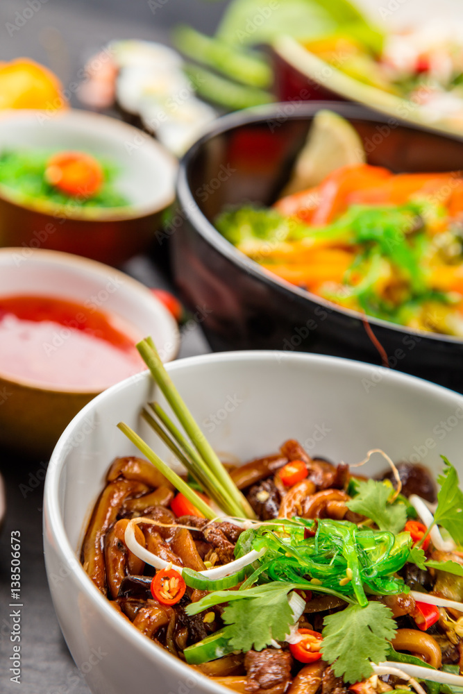 Asian food served on black stone Asian food served on black stone