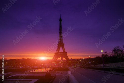 Awesome incredible pink-orange-lilac sunrise. View of the Eiffel Tower from the Trocadero. Beautiful cityscape in backlit morning sunbeam. Paris. France. © Sodel Vladyslav