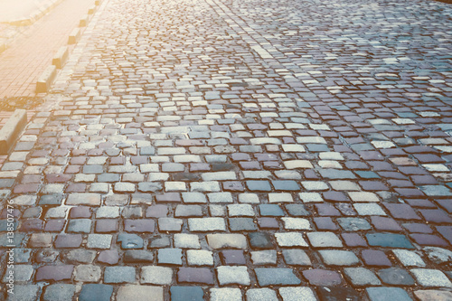 old pavement , paving the road surface , the road of stones photo