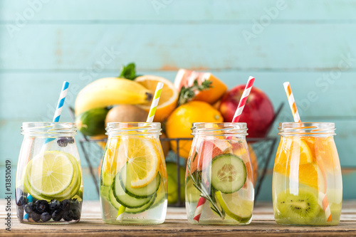 Photos Variety of fruit infused detox water in glass jars for a healthy diet eating