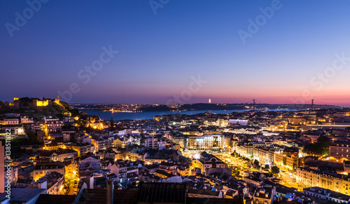 Aerial evening Panorama of Lisbon - illuminated Avenues and river in the background