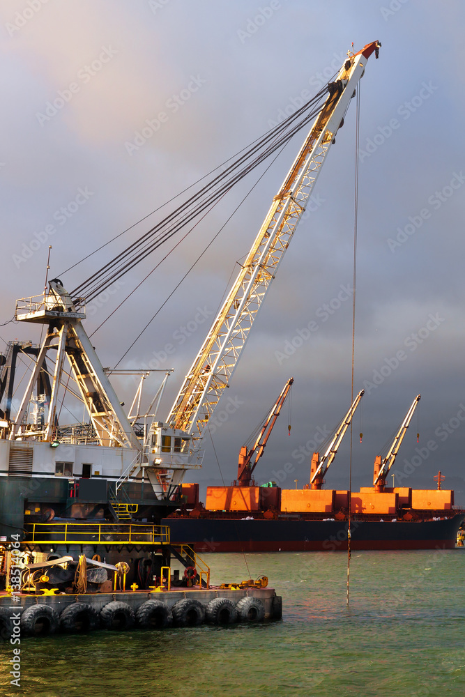 Dredger digging a shipping channel in the container port at Oakland, California