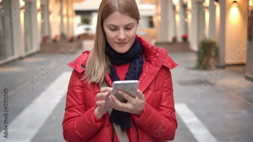 Wallpaper Mural Beautiful woman with smartphone in mall. Browsing internet, communicating with her friends. Torontodigital.ca