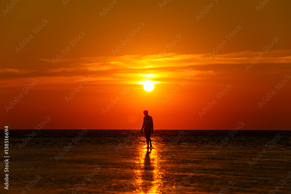 Shadow Man sunrise over the sea evening.