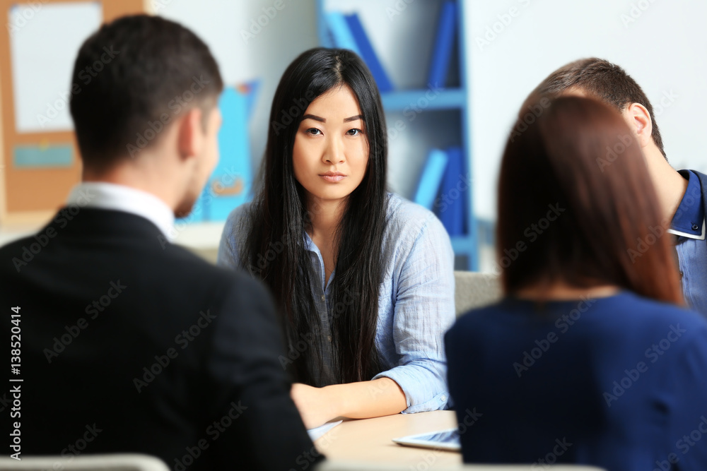 Businesswoman with colleagues in conference room Businesswoman with colleagues in conference room