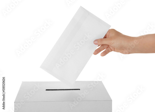 Female hand putting voting ballot into the box  on white background