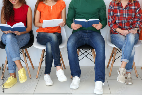 Group of people with books ...