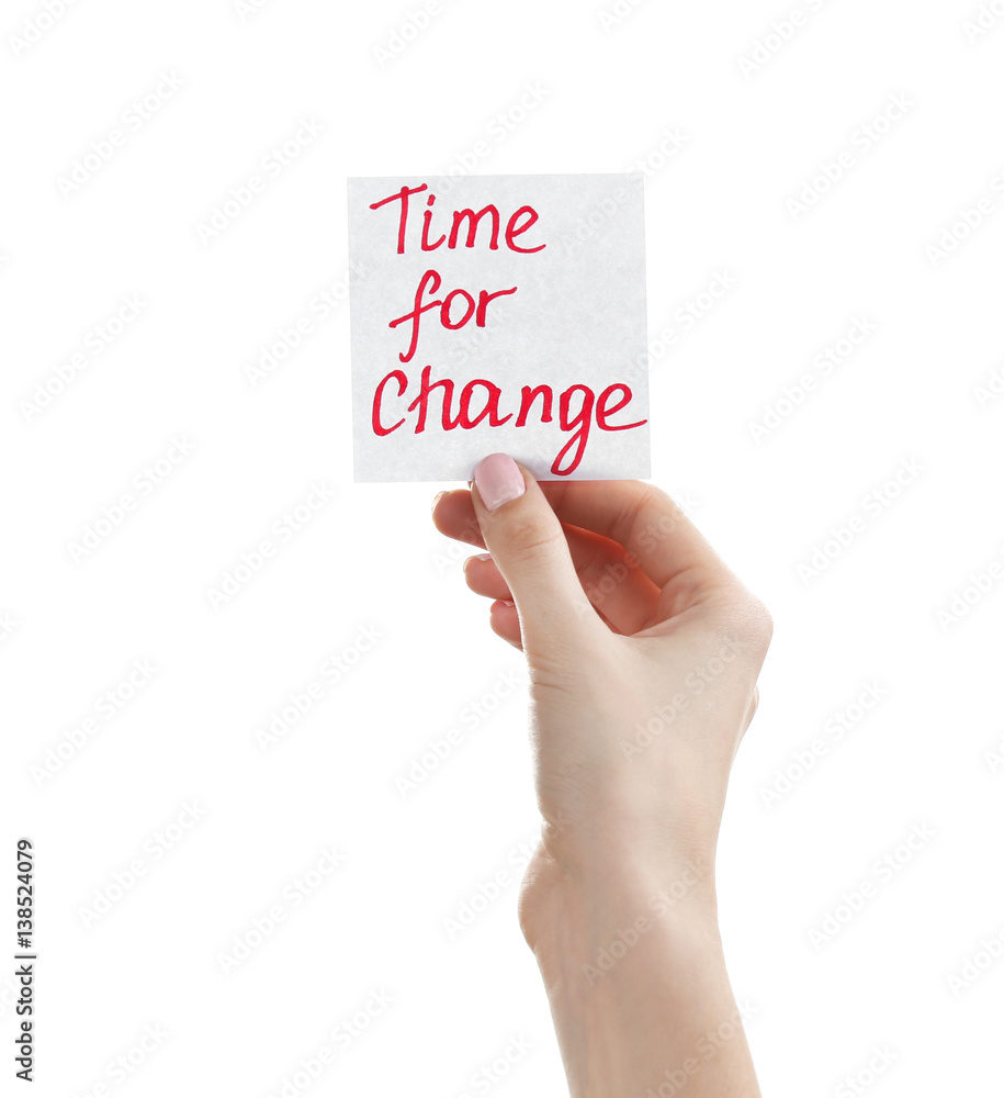 Female hand holding note with phrase TIME FOR CHANGE on white background Female hand holding note with phrase TIME FOR CHANGE on white background