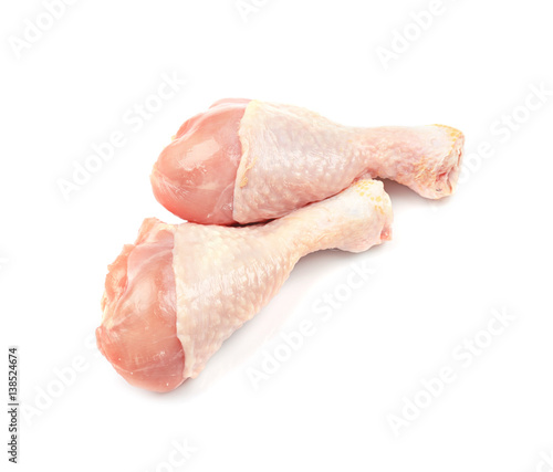 Raw chicken legs on white background