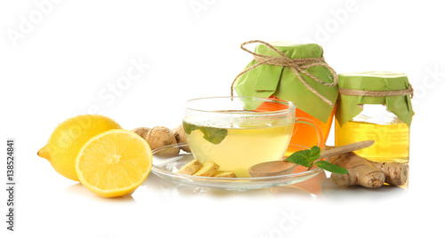 Natural medicine concept. Ginger honey tea with lemon and mint on white background