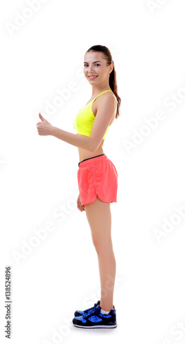 Incorrect posture concept. Young woman showing thumb up gesture on white background