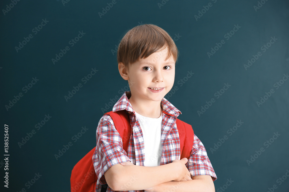 Cute little boy on school blackboard background Cute little boy on school blackboard background