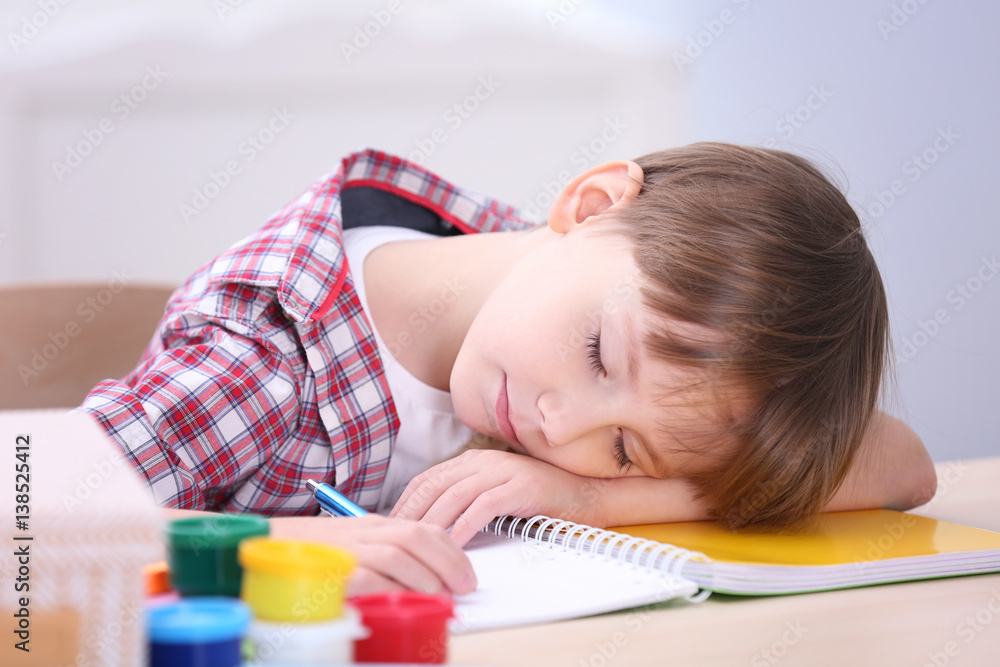 Cute little boy studying at home Cute little boy studying at home