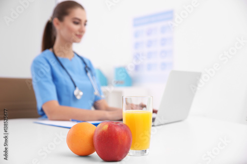 Fruits and glass of juice w...