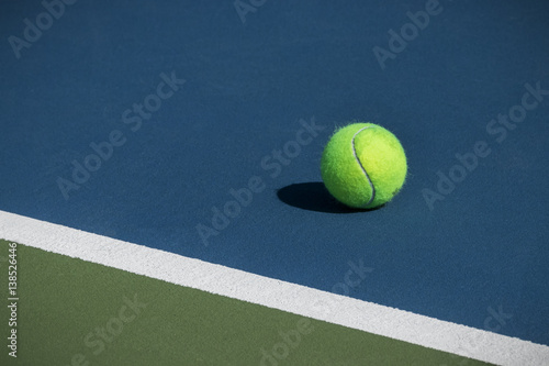 Tennis ball on a blue court © Dale