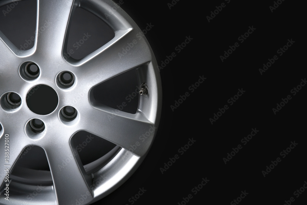 Obraz premium Car wheel on dark background