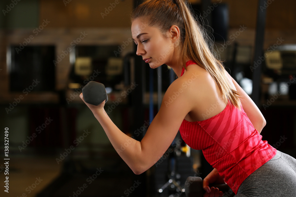© megaflopp - Sporty young woman work out biceps © megaflopp - Sporty young woman work out biceps