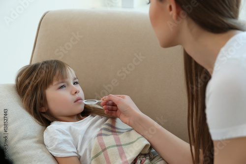 Mother giving her daughter ...
