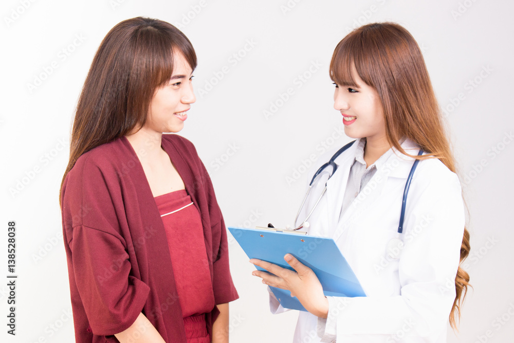 Young asian doctor woman talking with female patient Young asian doctor woman talking with female patient