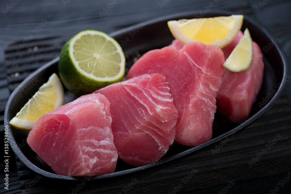 Slices of raw fresh tuna fillet, close-up, selective focus Slices of raw fresh tuna fillet, close-up, selective focus