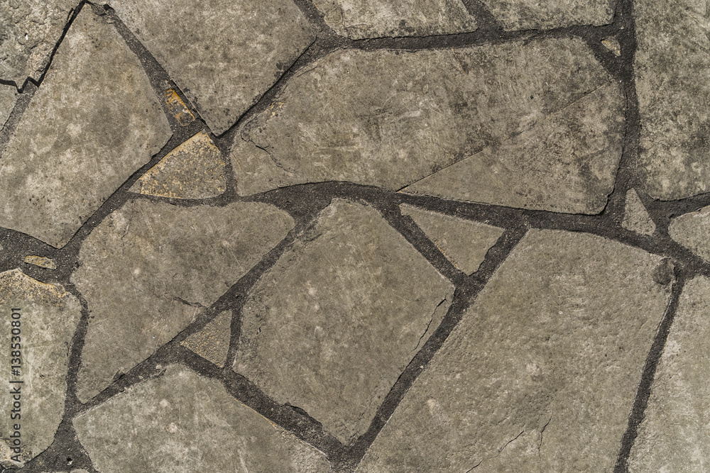 Fototapeta premium View of monotone gray brick stone on the ground for sidewalk and driveway