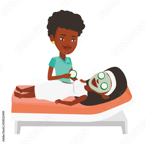Cosmetologist making beauty treatments to woman.