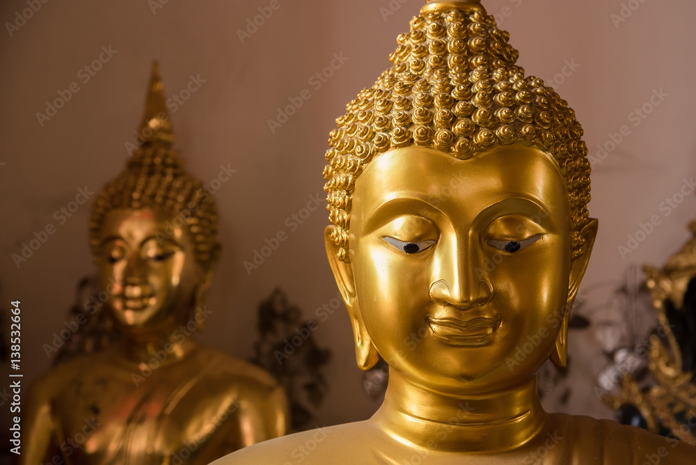 The face of Buddha.Golden Buddha at Poramai Yigawat Temple in Nonthaburi, Thailand.