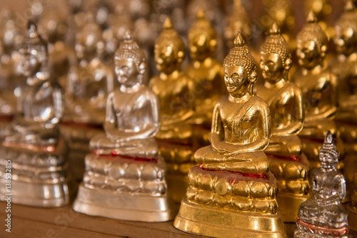 Little buddha statues in temple Thailand.